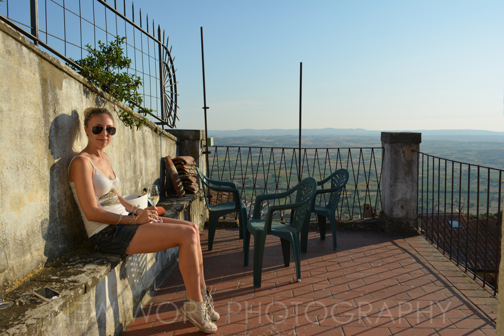 Girl on balcony in Tuscany